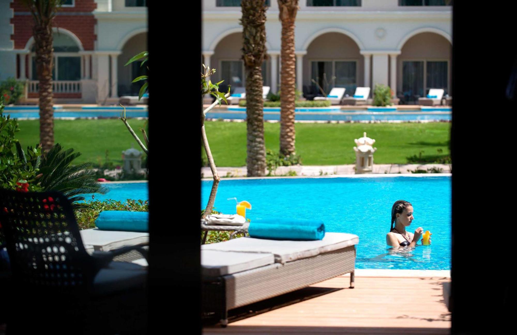 Baron Palace Sahl Hasheesh Hurghada Buitenkant foto The swimming pool at the hotel